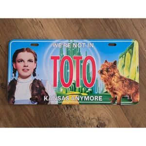 Wizard of Oz Dorothy Toto We're Not In Kansas Anymore Metal License Plate Sign
